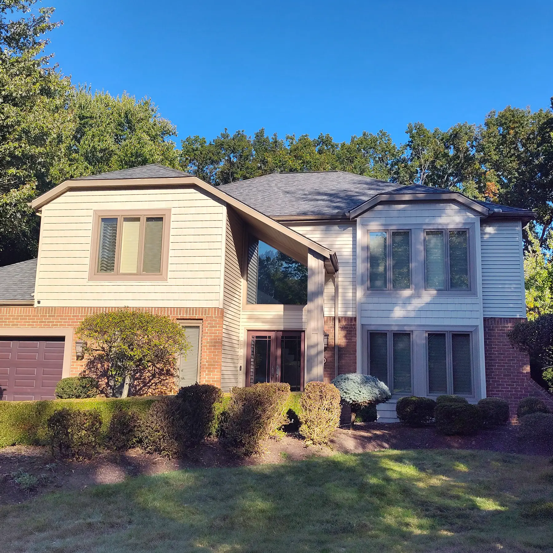 Roof replacement, siding, gutters and downspouts by Biltmore Exteriors