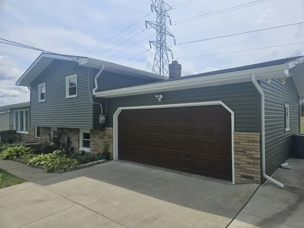 Replaced siding, gutters, soffit, fascia, and window wraps in Canton by Biltmore Exteriors