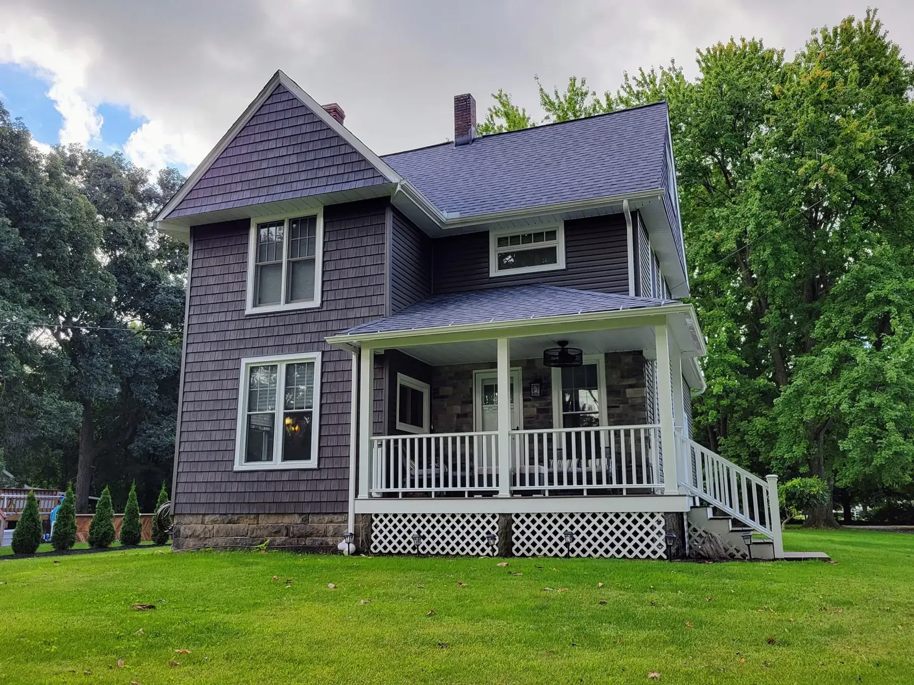 New cedar shake siding and roof replacement by Biltmore Exteriors