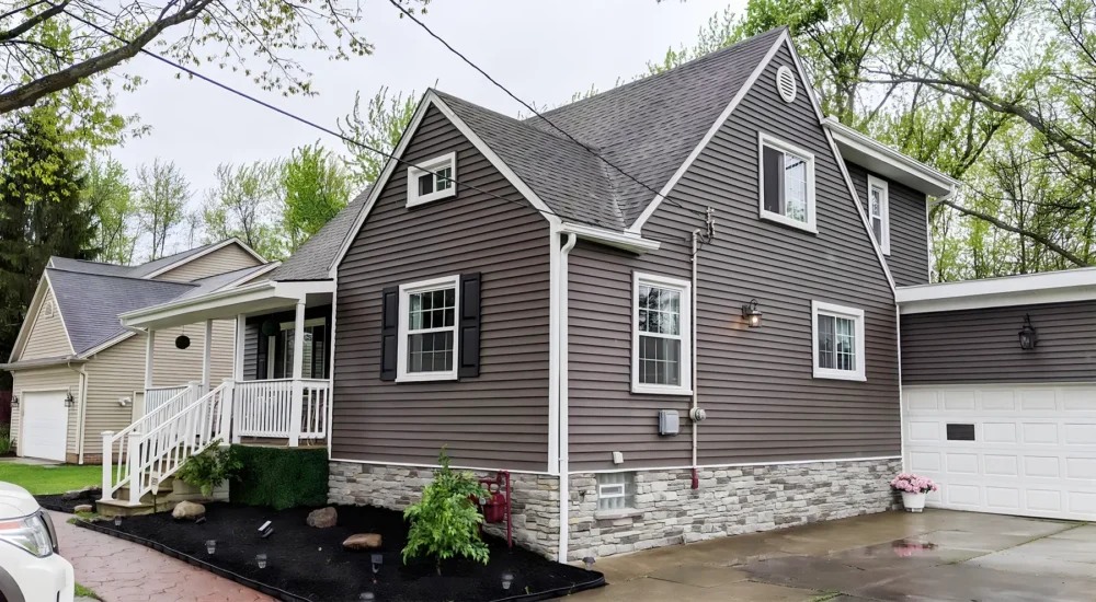New siding, stonework, and gutter installation