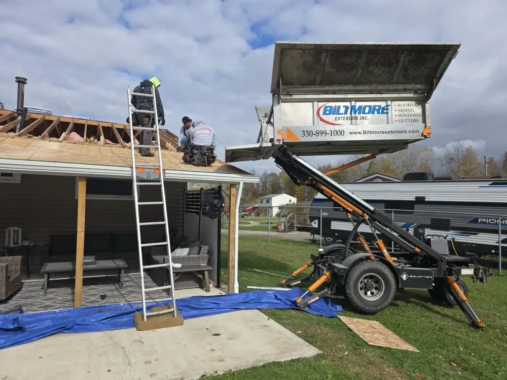 Roof replacement in progress by Biltmore Exteriors