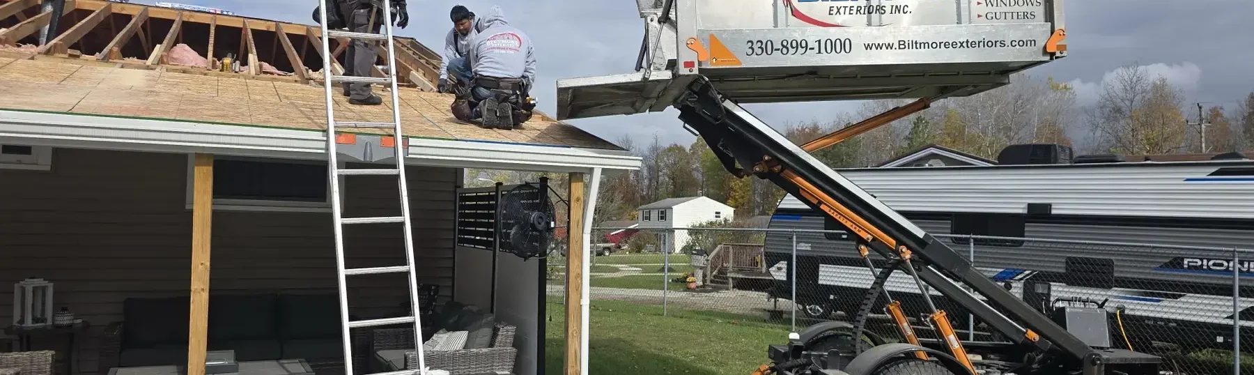 Roof replacement in progress by Biltmore Exteriors