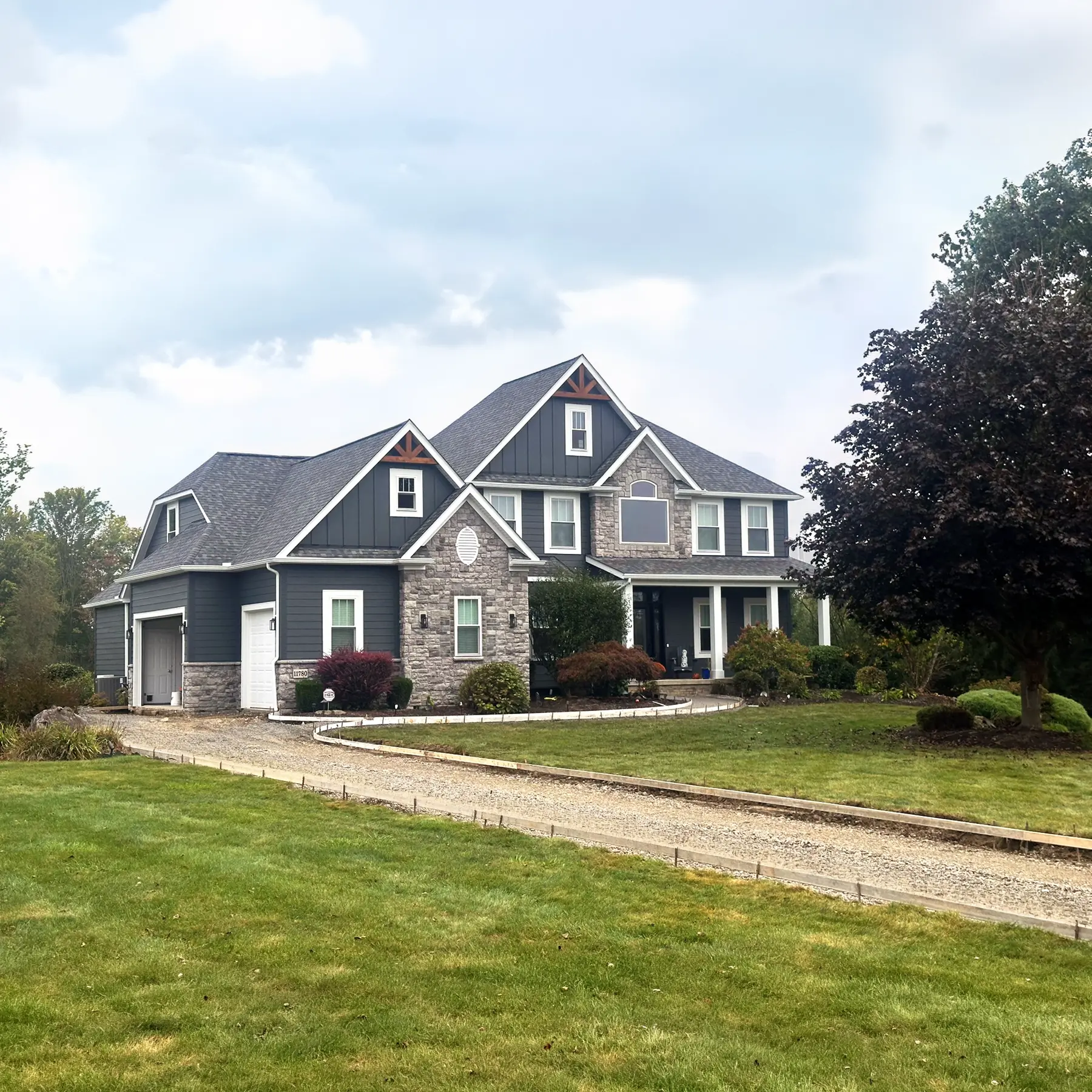 New siding, windows, and entry door in Chagrin Falls Ohio by Biltmore Exteriors