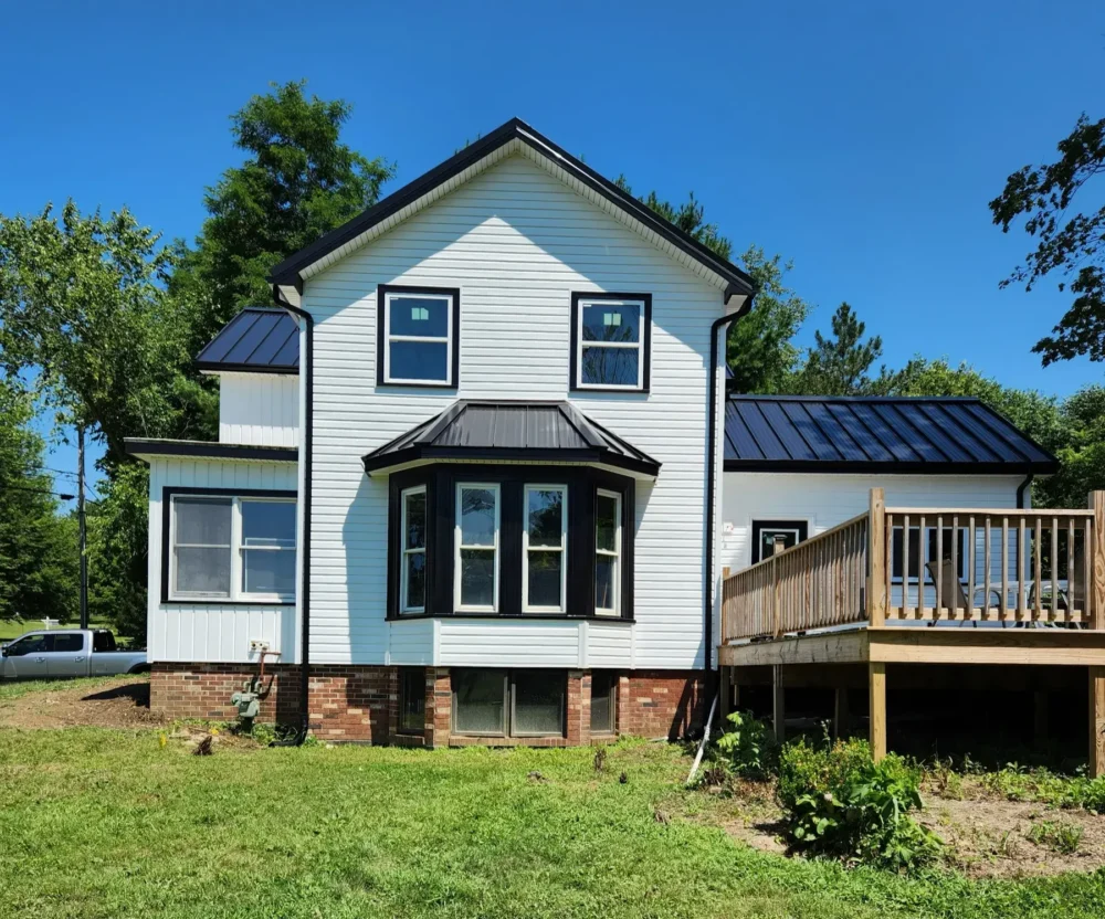 Biltmore Exteriors installed Certain Teed Restoration Classic Vinyl Siding and Board and Batten, wrapped windows and doors, and added new soffit and fascia